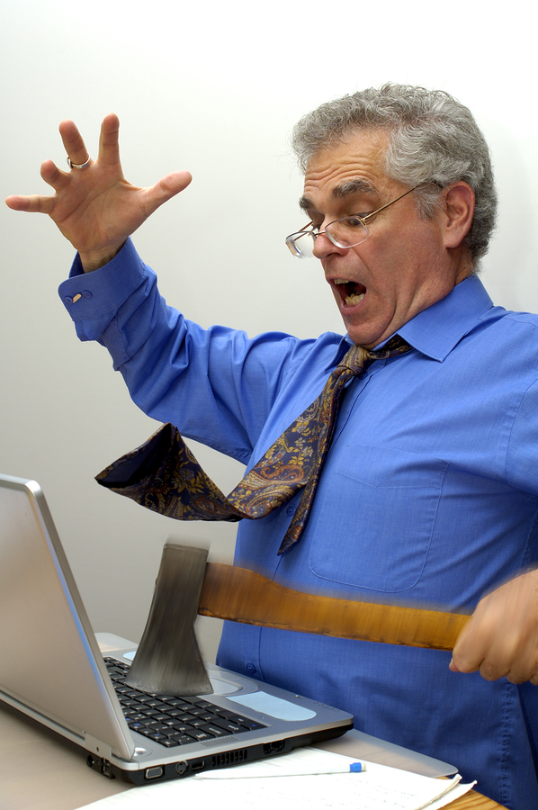 Photo of man destroying a laptop